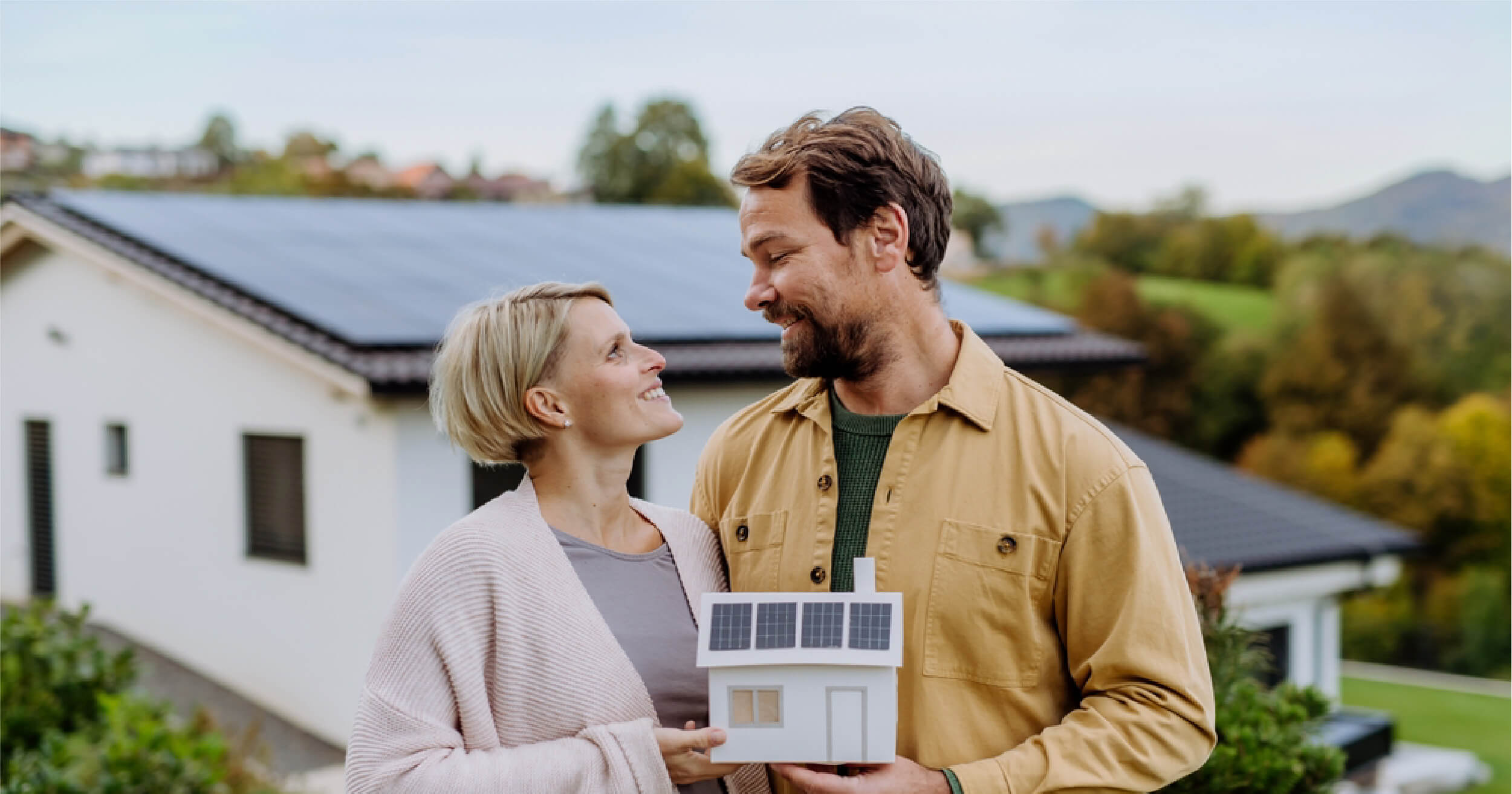 A_happy_Australian_couple_with_a_solar_energy_system_installed_in_their_home.jpg