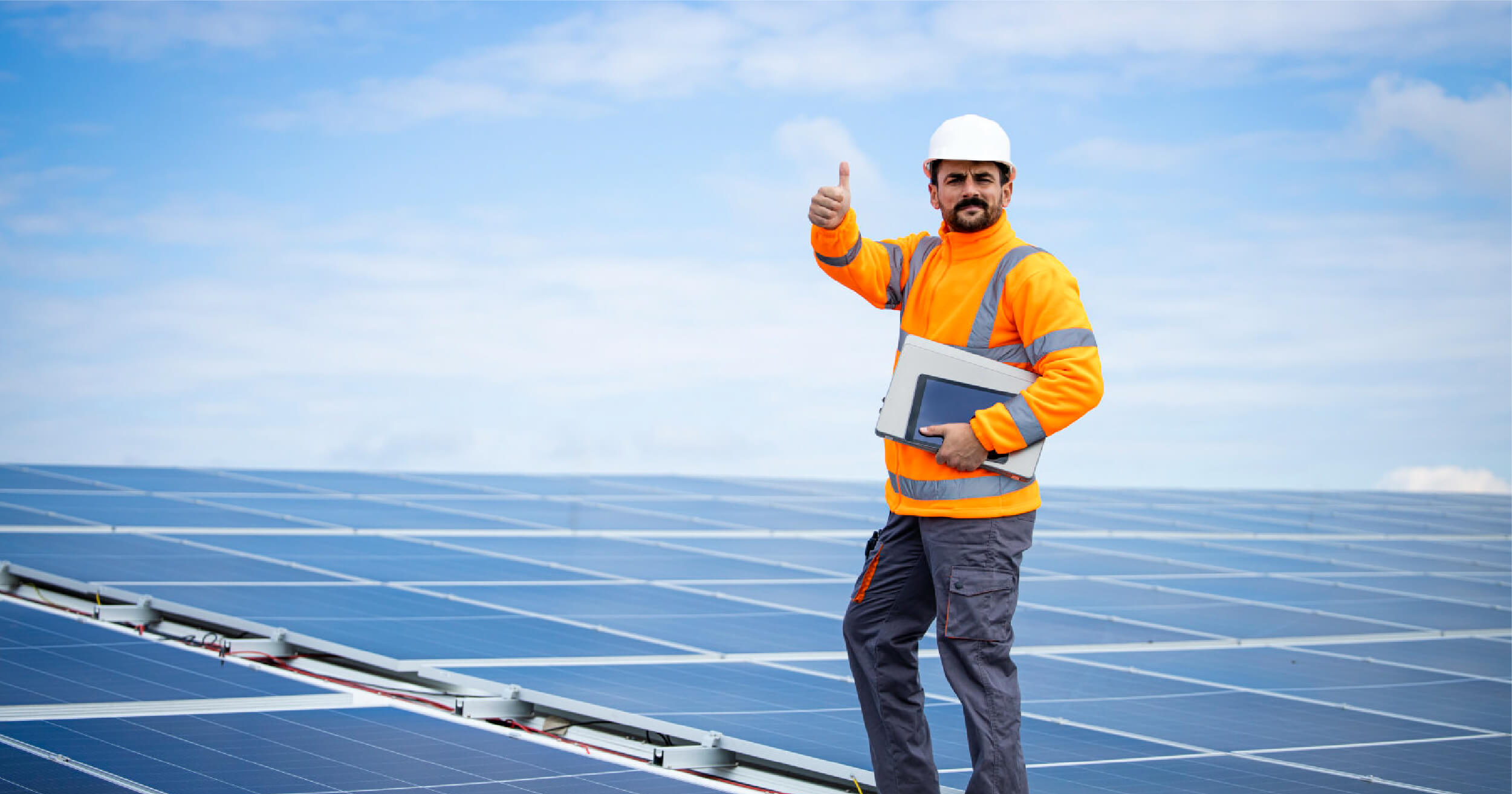 An_Australian_Solar_installer_putting_his_thumbs_up_after_installing_solar_panel.jpg